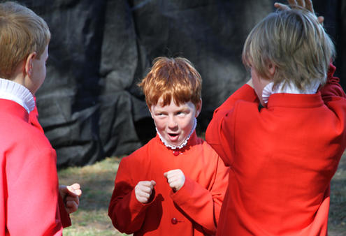 Backstage before the main event - and a couple of bantamweight choristers stage a mock square-off.