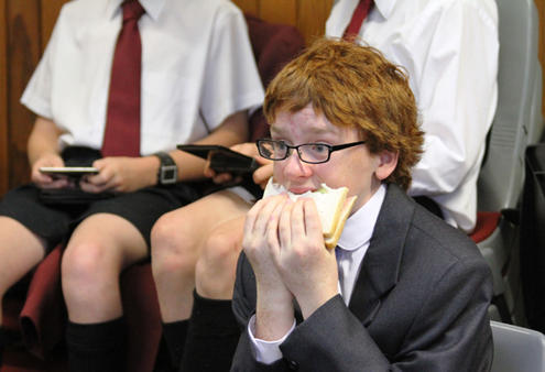 Chorister Patrick Manning fortifies himself for the feature duet, "Pie Jesu", with Dame Malvina Major.