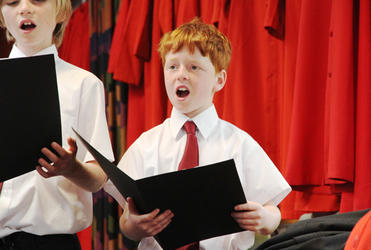 Junior chorister Benedict Sullivan rehearses before the memorial service.