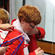 Patrick Manning gets a hand to slip into his chorister's robe.