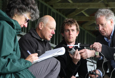 Archdeacon Robin Kingston, who chaired the organising committee, briefs reporters in the grandstand where the service was held.
