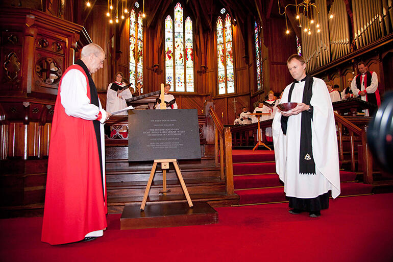 Archbishop Justin Welby dedicates the Foundation Stone for the new chapel. that's the Rev Tony Surman at right.