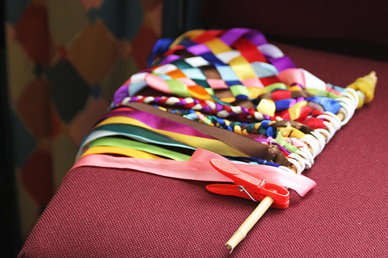 "Ribbons of unity" - one of the side-tasks the women did was to weave ribbons of unity.