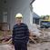 General Secretary Michael Hughes amid the rubble of the chapel at Churchill Courts in the suburb of Shirley.