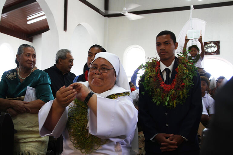 Sr Fehoko, of Nuku'alofa's Community of the Sacred Name, leads Saturday's gospel procession, with Kolini Hiko beside her.