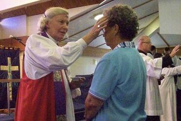 Bishop Victoria Matthews applies the mark of penitence during the Ash Wednesday service in Christchurch. Photo: Philip Baldwin