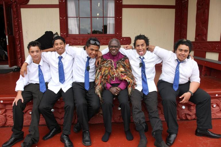 Some of the guys from the Waitara High School kapa haka troupe kick back with the Archbishop at Owae Marae.