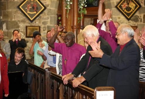 Various Anglicans show their approval of "The Tenners", a vocal group from Sacred Heart Girl's College.