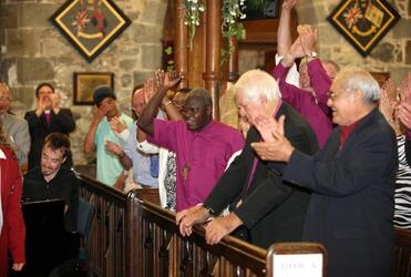 Various Anglicans show their approval of "The Tenners", a vocal group from Sacred Heart Girl's College.