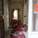A glance inside the front door. Note the damaged wall plaster - and the official 'unsafe' sticker on the glass.