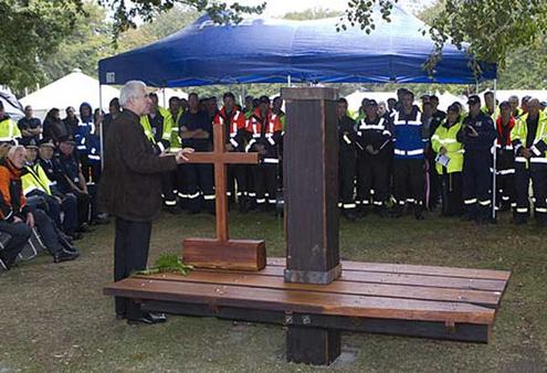 Dean Peter Beck with a cross and bench fashioned from the ruins of ChristChurch Cathedral. Photo: Don Scott/The Press