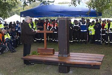 Dean Peter Beck with a cross and bench fashioned from the ruins of ChristChurch Cathedral. Photo: Don Scott/The Press