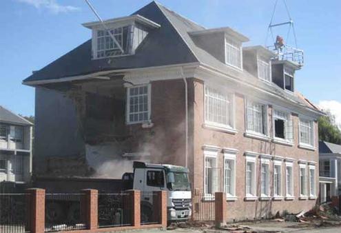 The Statham Building at Cathedral Grammar is prepared for demolition.