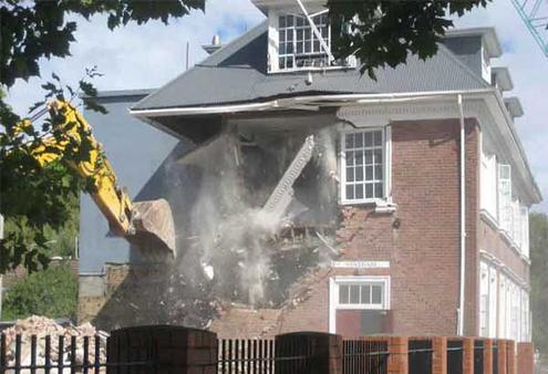 The Statham Building at the Cathedral Grammar School crumbles in the aftermath of the Christchurch quake.