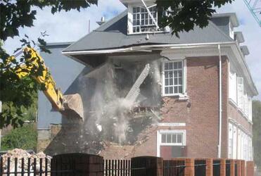 The Statham Building at the Cathedral Grammar School crumbles in the aftermath of the Christchurch quake.