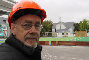 After the 12:51pm quake, there was a headcount on the court behind Malcolm Long. Prefab classrooms may soon sprout there. 