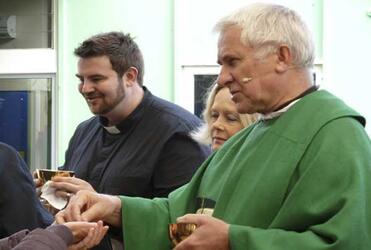 Deacon Spanky Moore, Nicki Lee and Dean Peter Beck administering communion at the cathedral eucharist. Photo: Chris Church
