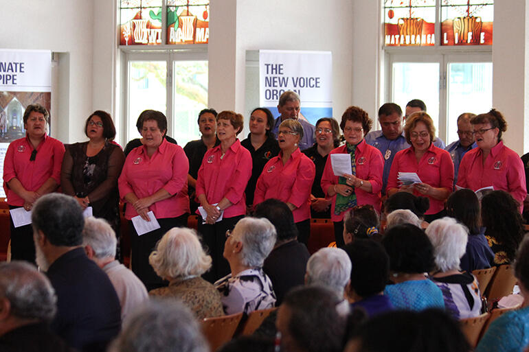 "The Angies" - the Auckland Anglican Maori Club, resplendent in pink and blue, contributing a waiata.