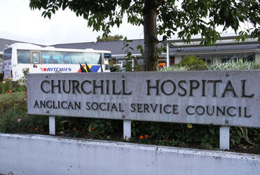 The first of the evacuation buses pulls into the entrance to Churchill Hospital - which is part of the Churchill Courts complex. 