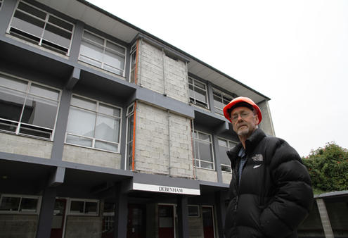 Malcolm Long outside the Debenham building, where the older boys are taught. Debenham has been damaged by subsiding land.