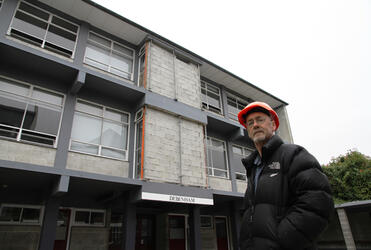 Malcolm Long outside the Debenham building, where the older boys are taught. Debenham has been damaged by subsiding land.