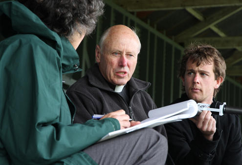 Archdeacon Robin Kingston handles some last minute media interviews.