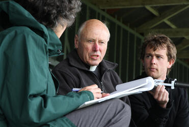 Archdeacon Robin Kingston handles some last minute media interviews.