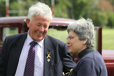Bernie Monk, spokesman for the families of the lost miners, shares a lighter moment with Marge Tefft.