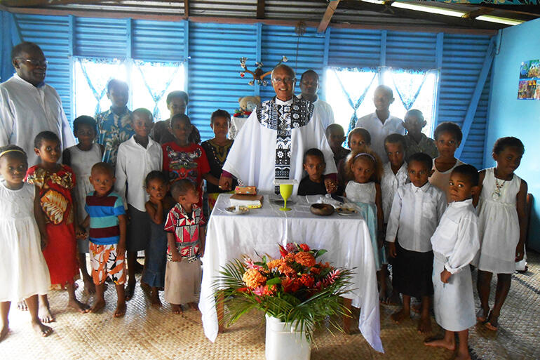 Easter Day, 2014, in the chief's home at Maniava. This was destroyed in the cyclone, and the chief's family survived by sheltering under the floor.