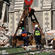 A massive crane lifted this giant bucket to the top of the tower, and used it to chomp off tonnes of unsafe masonry.