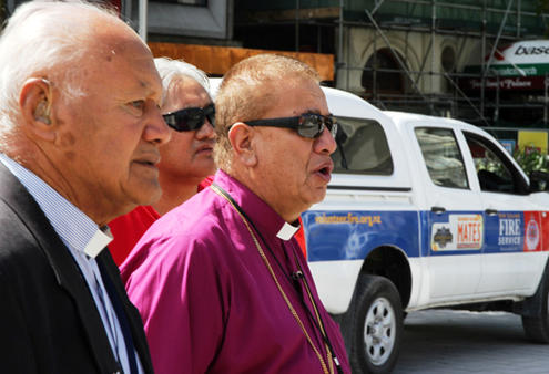 Canon Andy Joseph, Stacey Hakaraia and Bishop John Gray begin their karakia as they move towards the cathedral.
