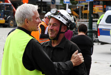 Dean Peter Beck with one of the leaders of the Search and Rescue operation.