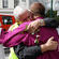 Karakia over, Dean Peter Beck embraces Bishop John Gray.