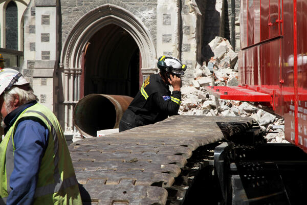 The steel pipe protruding from the cathedral doorway gives USAR workers greater safety during the recovery operation.
