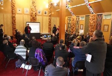 Allen Hawea helps deliver the youth presentation to one of the plenary sessions at the forum.