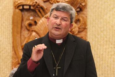 Archbishop Roger Herft makes a point during his keynote address.
