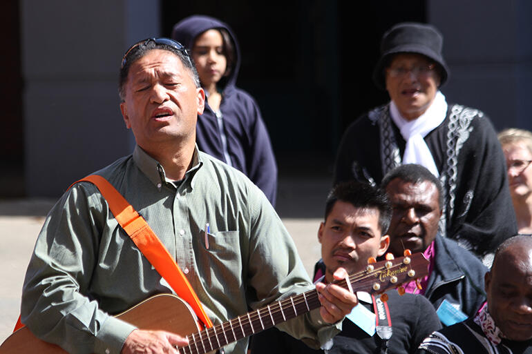 Heartfelt music: John Tapiata leads a waiata for the overseas manuhiri. Heartfelt music: John Tapiata leads a waiata for the overseas manuhiri.