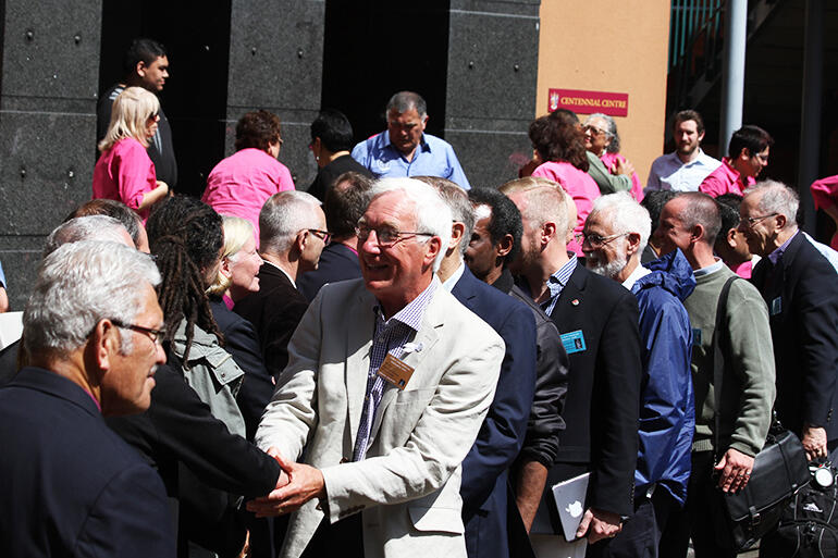 John Rea, of Scotland, catches up with a long-lost friend in the hongi line.