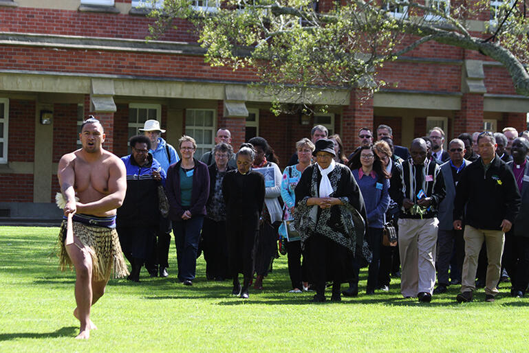 Rakiti Clark leads the overseas manuhiri on to the marae. Rakiti Clark leads the overseas manuhiri on to the marae.