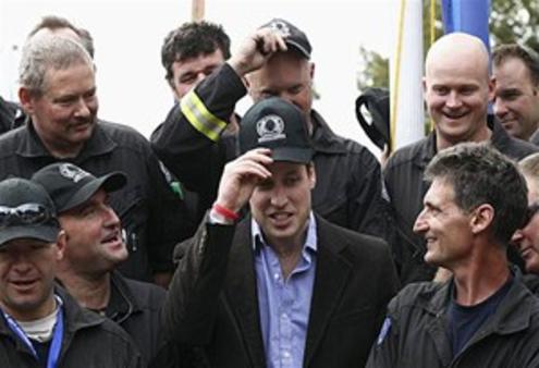 Prince William poses with members of the Urban Search and Rescue team in Christchurch. Photo: Reuters
