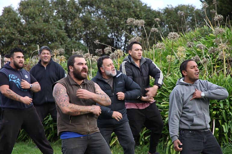 The sound and the fury - from a peaceful people. Ruakere Hond (in the puffer jacket) leads a rolling haka.
