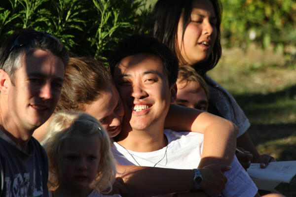 Summertime, and the living is easy... young folk relax on Ngatiawa's Grassy Knoll.