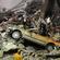Rescue workers search for victims under the rubble near the Canterbury Television building. Photo: Shuzo Shikano/AP
