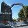 The demolition machine lays waste to the tower of St Mary's, Merivale.