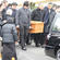 Sir Paul is borne from the hearse, and taken towards the steps leading into the church.