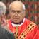 Archbishop Brown Turei administers the host to his brother Bishop Ngarahu Katene.