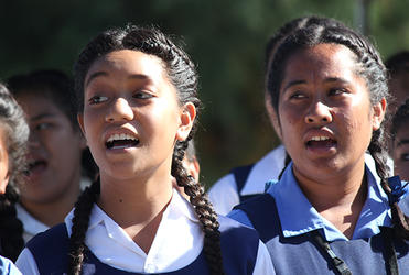 School girls singing their hearts out to the bishops and their spouses.