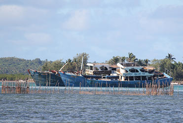 Two of the ships driven by hurricanes onto Pangaimotu - and abandoned there by their owners. 