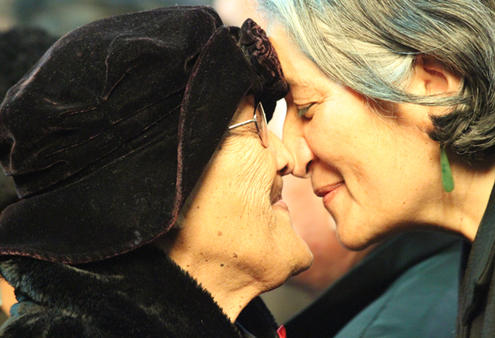 Aunty Wai, left, a visitor from Tainui, being welcomed by Mere Mangu for the tangata whenua.
