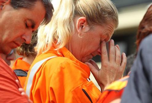 People pause and remember outside the Christchurch Art Gallery. Photo: Fiona Goodall/The Press